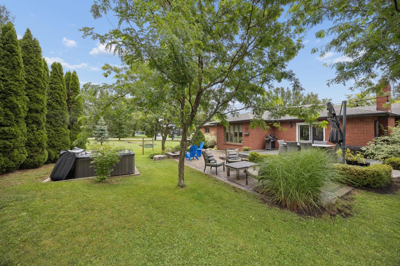 Backyard patio and hot tub at 30 Potters Lane on 0.78 acres